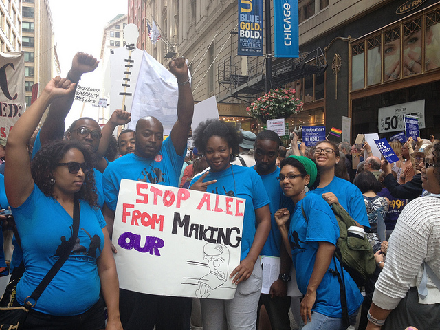 Group of young activists hold a sign "Stop ALEC From Making Our [Bills]" (Source: Cathy Sherwin)