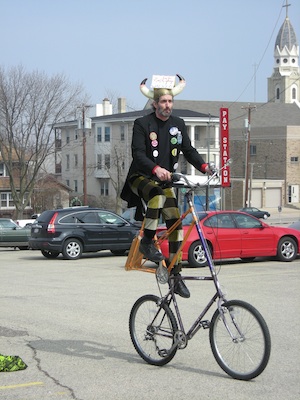 Man on a tall bicycle