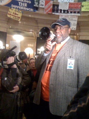 One hundred protesters hold their ground inside the Capitol today