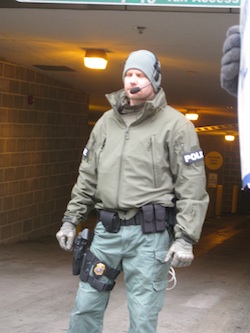 Police in riot gear guarding the "rat hole" entrance to the Capitol