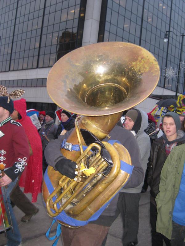 A brass band accompanies the New Orleans-style parade down State St